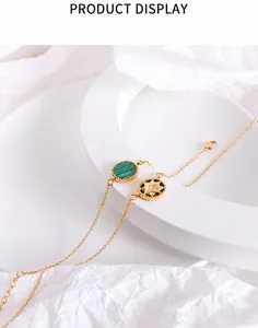 Detailed view of 18K gold plated octagonal star necklace with green malachite pendant