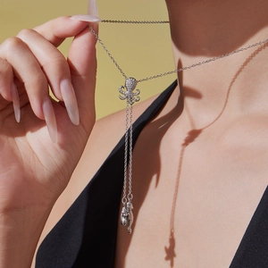 Silver starfish and octopus pendant necklace with sparkling crystals and tassel drops