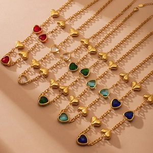 Golden stainless steel necklace set with heart-shaped colorful gems and gold charms