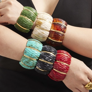 Chunky resin stretch bracelet with geometric texture and golden metal spacers for women
