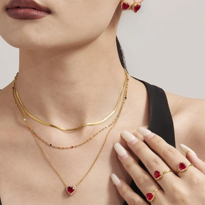Gold jewelry set featuring red heart-shaped zircon necklace earrings and rings for women