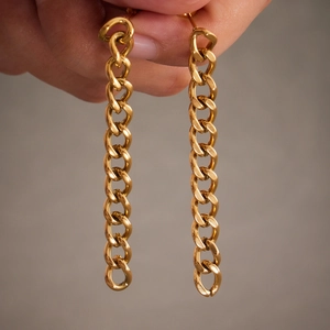 Elegant gold bow tassel chain drop earrings in polished stainless steel for women