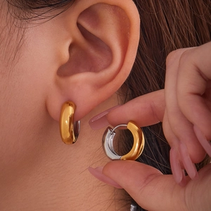 Modern U-shaped geometric two-tone stainless steel hoop earrings for a minimalist look