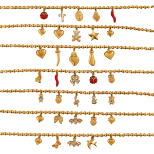 Bamboo style gold charm bracelet with diverse pendants like heart and clover icons
