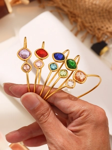 Detail of 18k gold plated bracelets with colorful faceted Czech glass stones