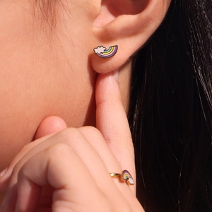 Rainbow and cloud jewelry set with gold ring and stud earrings on model for kids