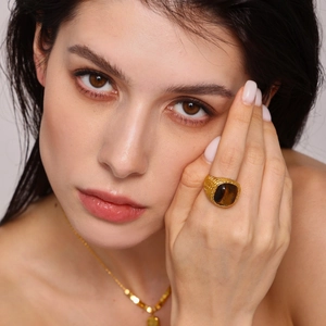 Vintage 18K gold plated stainless steel ring with oval tiger eye stone on model hand