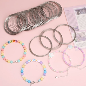 DIY jewelry kit with memory steel wire coils and colorful handmade beaded bracelets