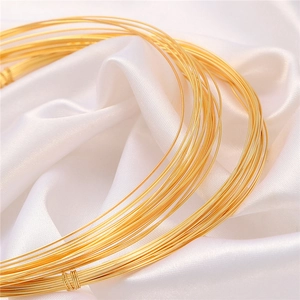 18K gold plated copper wire coil on white silk fabric for DIY jewelry making supplies
