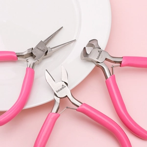 Three-piece pink handle jewelry tool set with round nose and wire cutting pliers