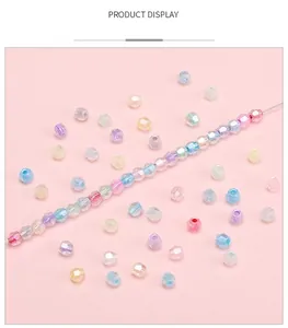 Detailed view of faceted candy-colored glass beads for DIY jewelry making