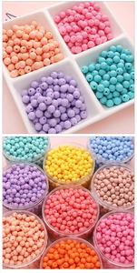 Macro shot of colorful matte acrylic beads for DIY jewelry making in macaron pastel colors