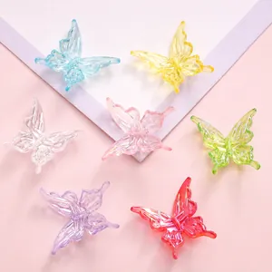 Macro view of 25mm 3D butterfly charms with textured wings and colorful gradient finish