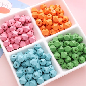 Octagonal colorful wooden beads for jewelry making displayed in a white sorting tray