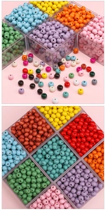 Detailed view of colorful 8mm round wooden beads sorted in a clear plastic storage box
