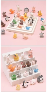 Detailed close-up of colorful flocked animal charms for DIY jewelry and phone accessories