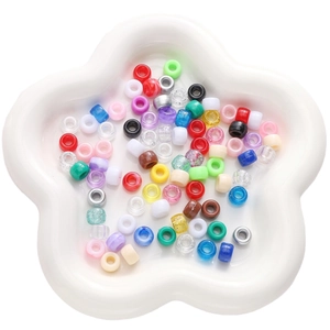 Colorful acrylic barrel beads in a flower tray for DIY handmade jewelry making