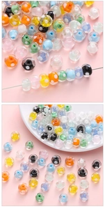 Close-up of colorful lampwork glass beads with white polka dots for DIY jewelry making