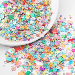 Mix of colorful iridescent sequins in heart and star shapes for DIY garment accessories