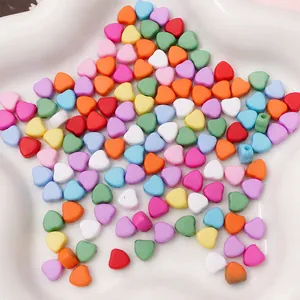Macro view of 7mm colorful acrylic heart beads for DIY jewelry and handmade bracelets