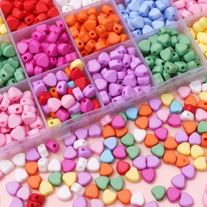 Multi-color 7mm heart acrylic beads set in a clear organizer box for DIY jewelry making