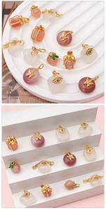Detailed macro view of 14K gold plated butterfly and lucky bag pendants for jewelry making