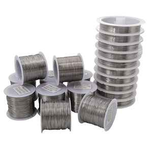 Macro shot of silver stainless steel jewelry wire spools in 0.3mm to 0.5mm diameters