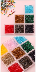 Macro view of colorful 2x4mm transparent glass beads for DIY jewelry in storage box