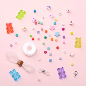 DIY jewelry making kit with 10 grids of colorful resin beads, star charms and accessories