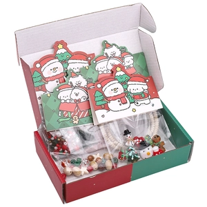 Christmas DIY bead kit with snowman and tree charms in a red and green gift box