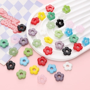 Colorful glass flower beads for DIY jewelry making displayed on a stylized backdrop