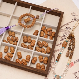 Handcrafted Zen style carved wood beads with Buddha and fish motifs for DIY jewelry