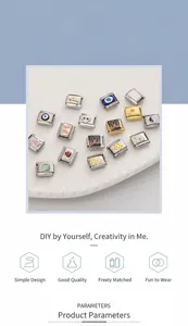 Detailed macro view of DIY stainless steel charm beads with enamel butterfly and heart designs