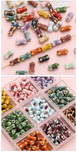 Macro shot of colorful bone-shaped ceramic beads for DIY jewelry making in storage box