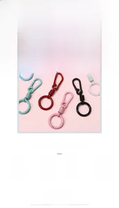 Macro detail of eight colorful macaron spring alloy keychains for DIY bag accessories
