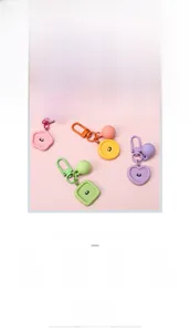 Macro detail of frosted macaron smile face resin charms in various geometric shapes