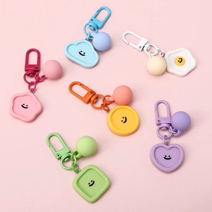 Colorful smiley face resin keychain set with geometric cloud charms in macaron candy colors