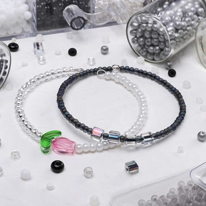 DIY handmade glass bead bracelets with floral tulip charms and clear cube beads
