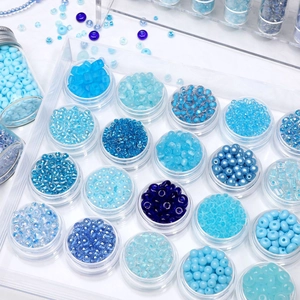 Blue tone glass seed bead set in organizers for DIY jewelry making and handmade crafts