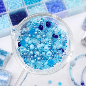 Blue glass seed bead assortment in various textures for DIY jewelry making and crafts