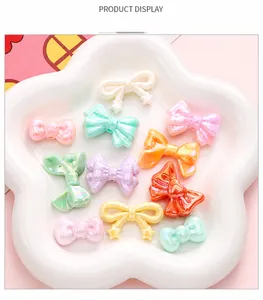 Close-up of colorful iridescent acrylic bow beads for DIY jewelry and hair accessories