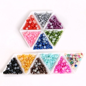 Colorful flatback half pearls in sorting trays for DIY hair accessory making