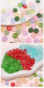 Macro detail of iridescent four-leaf clover glass beads for DIY jewelry making