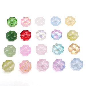 Colorful glass four-leaf clover beads in various finishes for DIY jewelry making