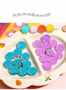 Colorful 20mm acrylic smiley face beads arranged in a cloud-shaped ceramic tray