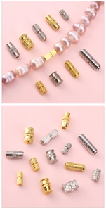 Detailed view of gold and silver screw clasps used for pearl necklace DIY jewelry making
