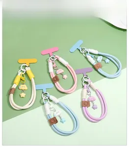 Detailed view of colorful braided phone lanyards with star cloud charms and T-pads