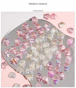 Macro shot of iridescent heart and star shaped ABS craft pearls for DIY jewelry