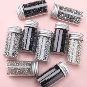 DIY jewelry making kit with glass seed beads in black and silver glass bottles