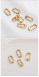 Gros plan de fermoirs à ressort ovales plaqués or 14K pour bijoux et accessoires